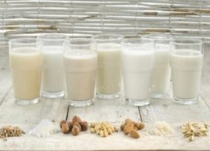 Various types of lactose-free milks in glasses